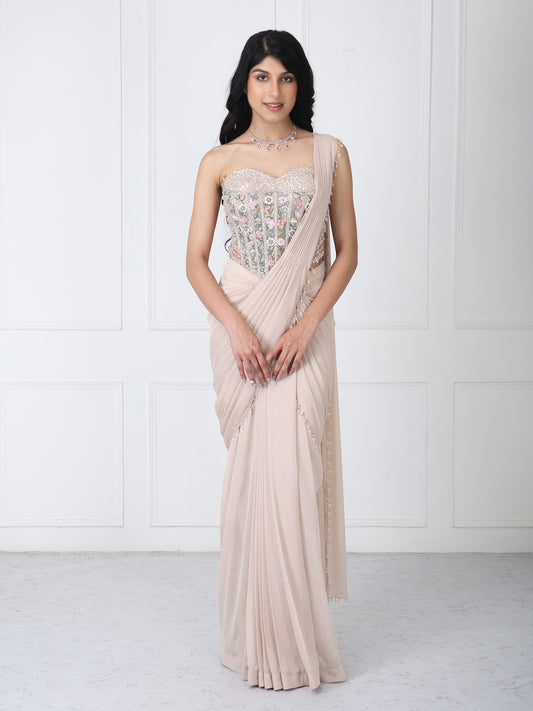 Beige drape saree with floral embroidered corset