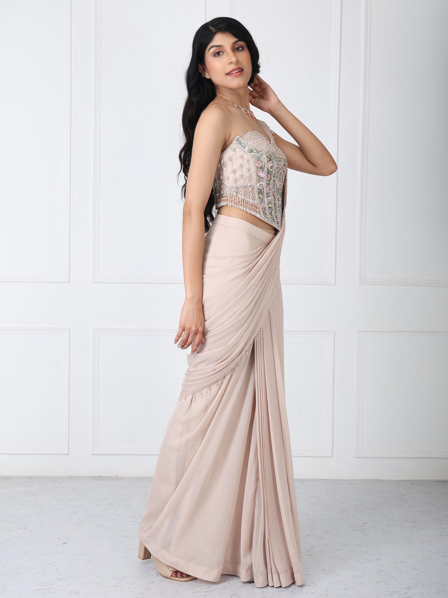 Beige drape saree with floral embroidered corset