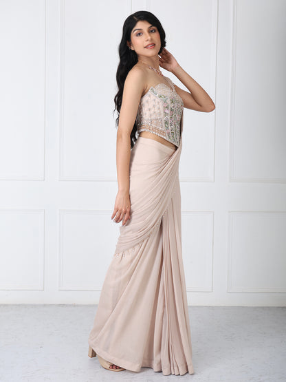 Beige drape saree with floral embroidered corset