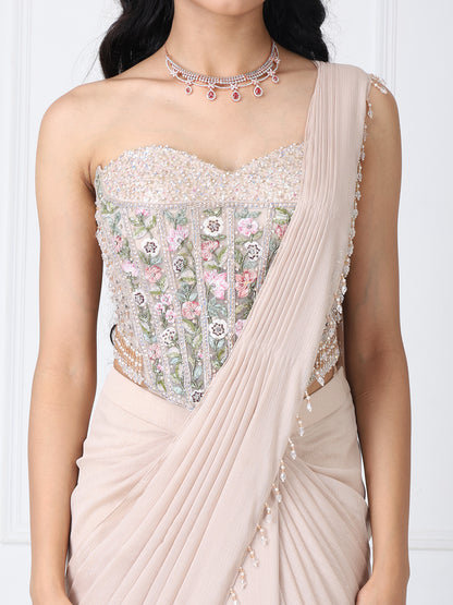 Beige drape saree with floral embroidered corset