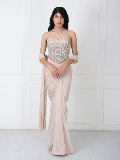 Beige drape saree with floral embroidered corset