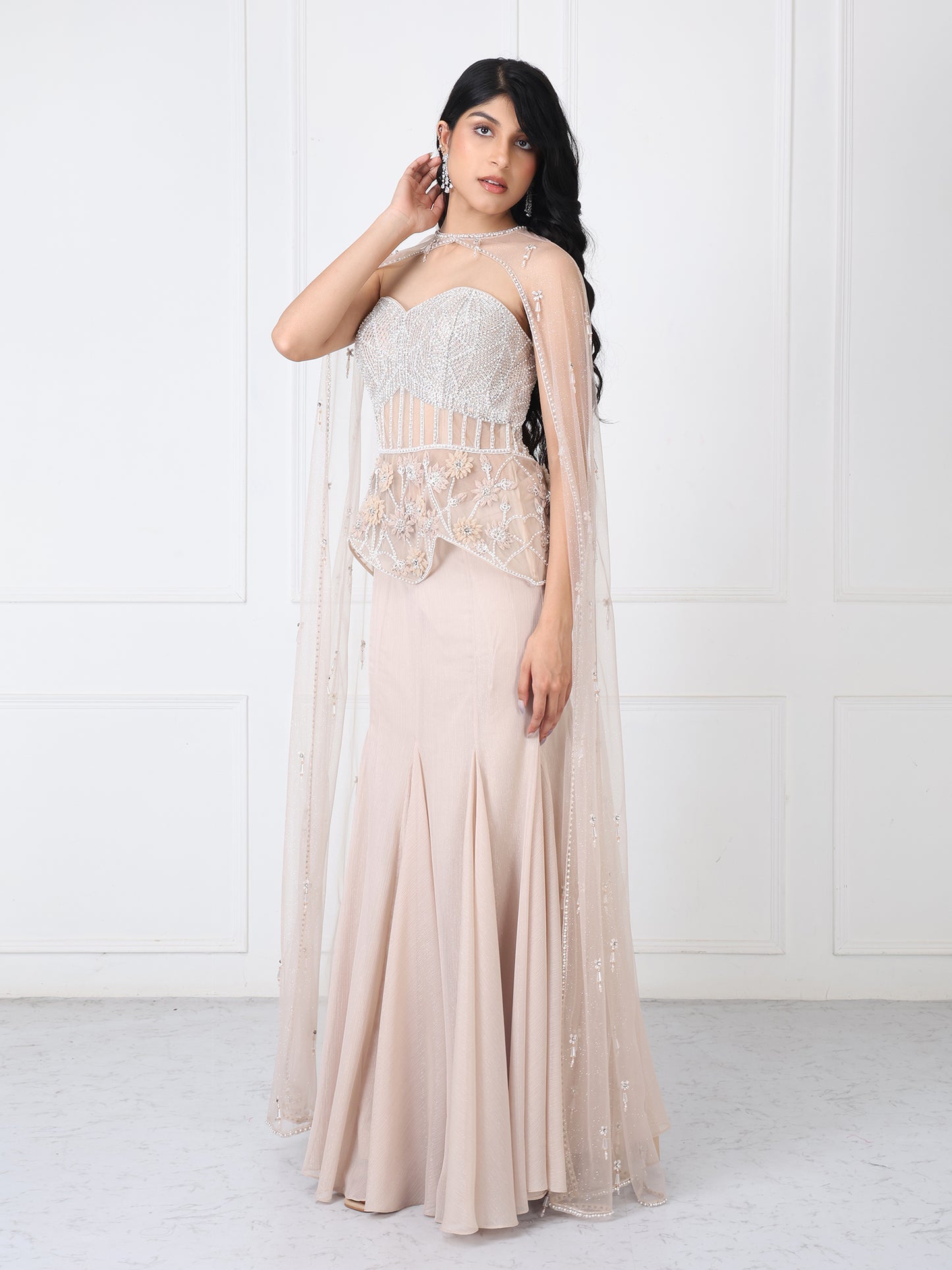 Beige embroidered corset and cape with paneled skirt