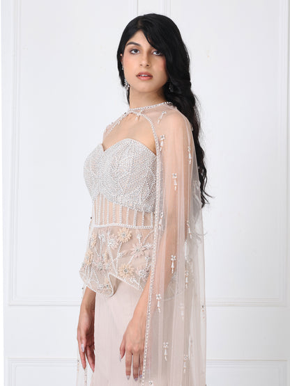 Beige embroidered corset and cape with paneled skirt