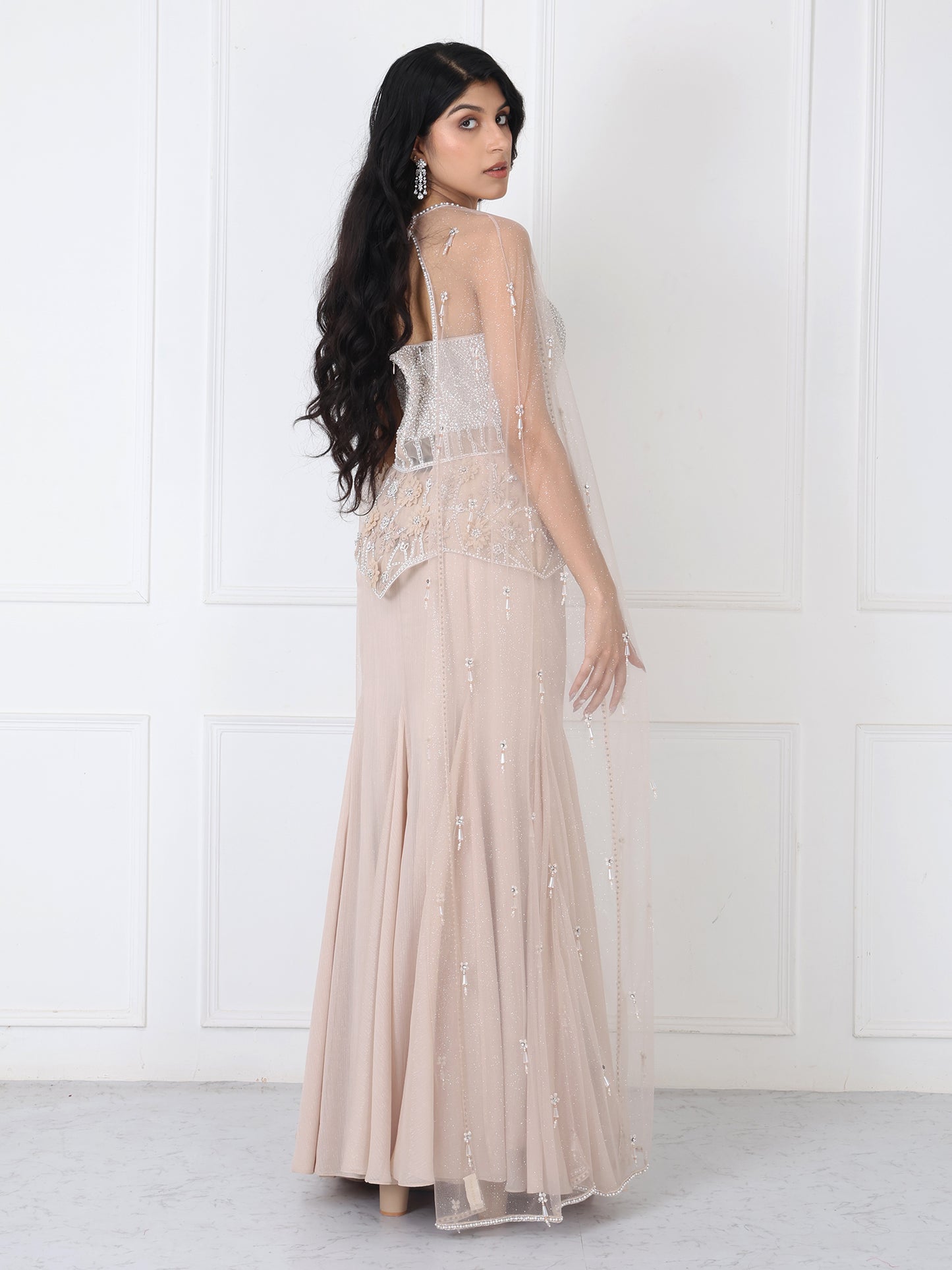 Beige embroidered corset and cape with paneled skirt